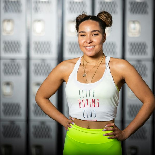 Person smiling and looking refreshed after a light workout session.