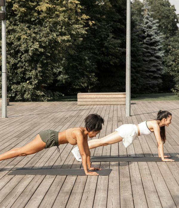Woman performing a gentle dynamic exercise in a calm environment.